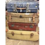 Early 20th century canvas and leather trunk and three other vintage suitcases