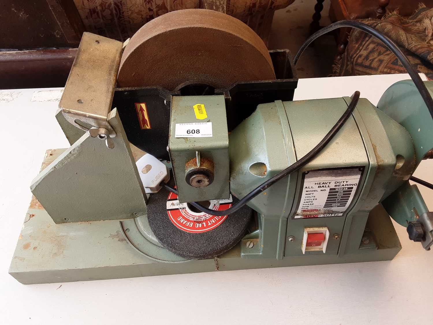 Electric bench grinder and an electric rotary sander