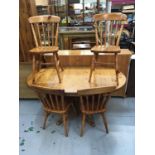 Pine oval breakfast table and four pine kitchen chairs