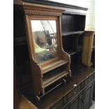 Antique pine hanging mirror with dentil border and two open shelves below, 57cm in length, 97cm in h