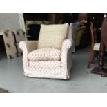 Single floral upholstered arm chair with cushions