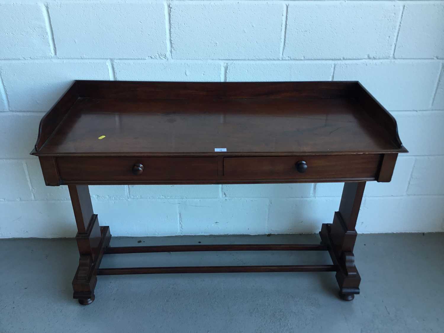 Victorian mahogany hall table with raised ledge back and sides, end standards joined by two stretche