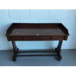 Victorian mahogany hall table with raised ledge back and sides, end standards joined by two stretche