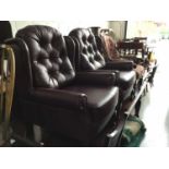 Pair of Contemporary plum coloured leather arm chairs with buttoned backs on cabriole legs, 108cm in