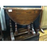 Small oak drop leaf occasional table on turned legs, together with another similar occasional table