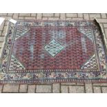 Persian carpet 152 x 105cm together with another Eastern rug 153 x 105cm (2)