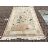 Chinese wash rug with Dragon decoration, 256 x 154cm together with another decorated with Tigers, 15