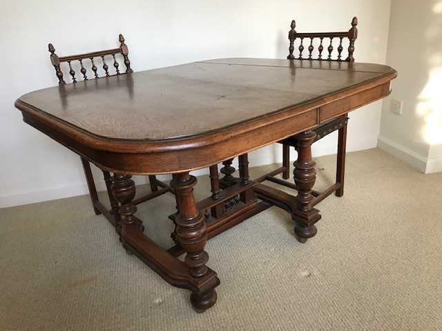 Late 19th Century French walnut extending dining table on turned legs joined by stretchers together