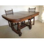 Late 19th Century French walnut extending dining table on turned legs joined by stretchers together