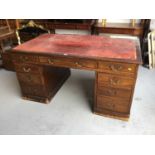 Large Antique style mahogany twin pedestal desk, inset red leather top above an arrangement of nine