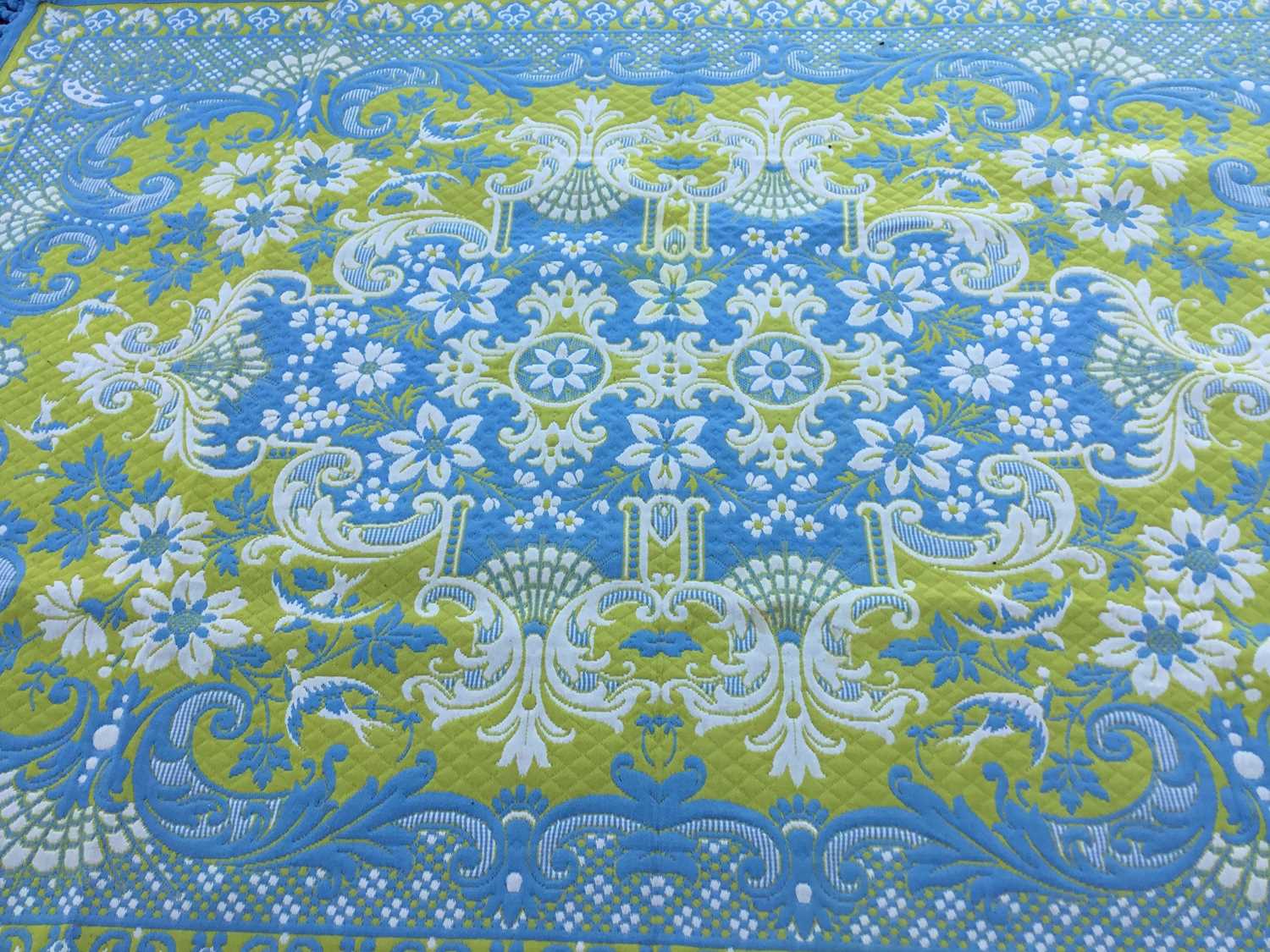 Pair of large woven rugs with foliate and scroll decoration on blue and yellow ground, each 294 x 21