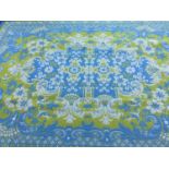 Pair of large woven rugs with foliate and scroll decoration on blue and yellow ground, each 294 x 21