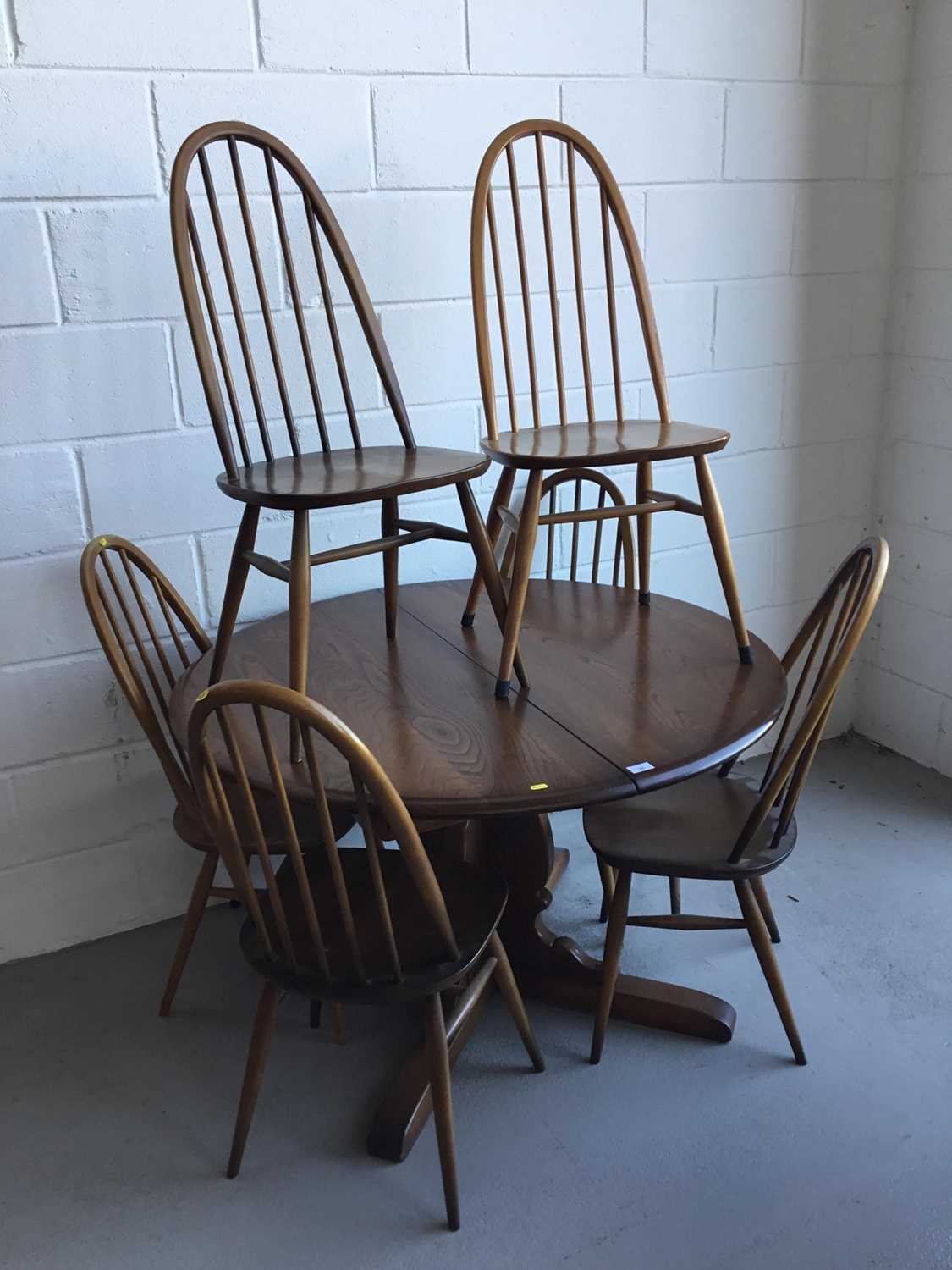 Ercol 'Golden Dawn' extending dining table of circular form, together with six Ercol stick back dini - Image 2 of 2