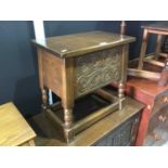 Reprodux oak stool / work box with carved decoration, hinged lid and bobbin turned legs joined by st