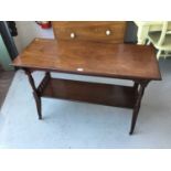 Edwardian Mahogany two tier occasional table with turned fluted column and legs on brass and ceramic