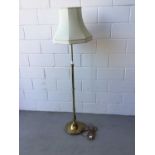 Brass standard lamp, with telescopic column and cream shade, 210cm in overall height (column extende