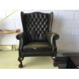 Leather button upholstered wingback armchair