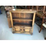 Manner of Titchmarsh & Goodwin- Good quality reproduction oak narrow bookcase of small proportions,