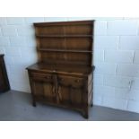 Ercol 'Golden Dawn' two height dresser with raised plate rack above, two draws and two panelled door