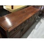 Suite of Chinese rosewood furniture comprising extending dining table, sideboard and set of eight ch