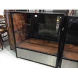 Pair of small black metal framed display cabinets