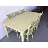 Large painted pine kitchen table on turned legs, together with six similarly painted chairs (7 piece