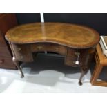 Queen Anne revival walnut and leather topped kidney shaped desk
