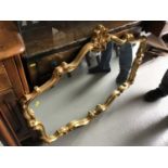 Antique style gilt framed wall mirror with shell and scroll decoration together with another mirror