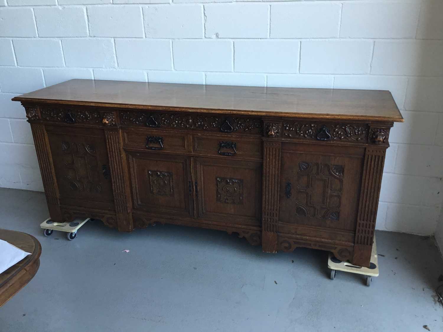 Large and impressive early 20th Century carved oak sideboard, six draws with carved floral decoratio