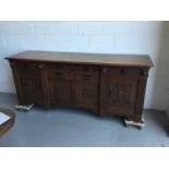 Large and impressive early 20th Century carved oak sideboard, six draws with carved floral decoratio
