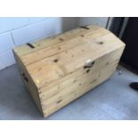 Antique pine dome topped trunk, with hinged lid and iron straps and handles, 94cm width, 55cm height
