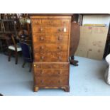 Reproduction Yew wood miniature chest on chest with an assortment of 12 draws, on bracket feet, 59cm