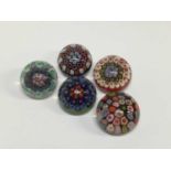 Five miniature Strathearn millefiori paperweights, approximately 4cm diameter