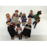 Small collection of dolls dressed in national costumes including Eskimo, Icelandic and others