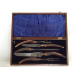 Edwardian five piece carving set with antler handles and silver ferrells, in original fitted case (S