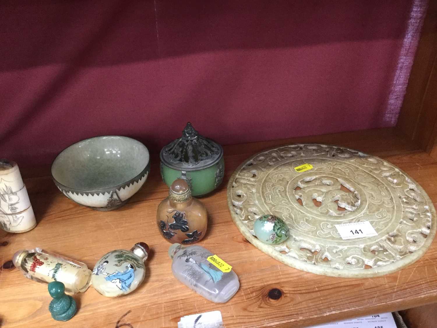 Chinese carved and pierced hardstone Bi disc, three Chinese greenstone bowls, Chinese snuff bottles