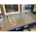 Large group of glass table wares to include wine glasses and others (qty)