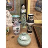 Two 19th century vases, knodding figure and a celadon pot with cover