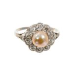 Antique pearl and diamond cluster ring with a cultured pearl (not tested for natural origin) surroun