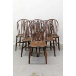 Six 19th century elm country Windsor stick back chairs with star motives to splats on turned legs