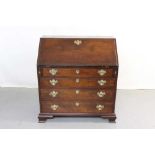 George III mahogany bureau, with fitted interior and four long graduated drawers pin bracket feet, 9
