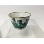 Chelsea tea bowl, painted in green monochrome with a continuous landscape