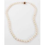 Cultured pearl necklace with a 9ct gold garnet and cultured pearl cluster clasp
