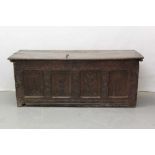 Large 17th century carved oak coffer with tulip decoration
