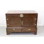 Georgian mahogany chest converted to a cupboard with two doors with brass mounts and carrying handle