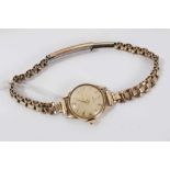 1950s ladies Omega 9ct gold cased wristwatch on rolled gold bracelet with original receipt of purcha