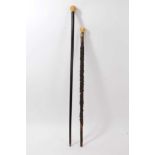 19th century ebonised cane with Japanese carved ivory knop, and another cane