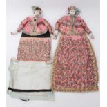 Unusual pair of early 20th century Eastern fabric dolls, applied with sequins and gilt threads, 48cm
