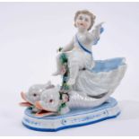 KPM figure of a cherub on classical dolphins