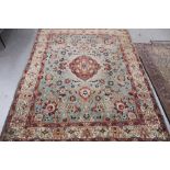 Antique Heriz style carpet, with central medallion and meandering lotus flower ornament on duck egg